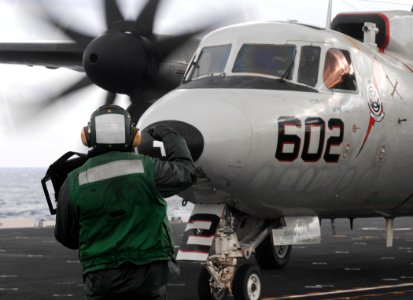 US Navy 070119-N-5345W-068 An aviation boatswain's mate displays the weight board to the pilots of an E-2C Hawkeye