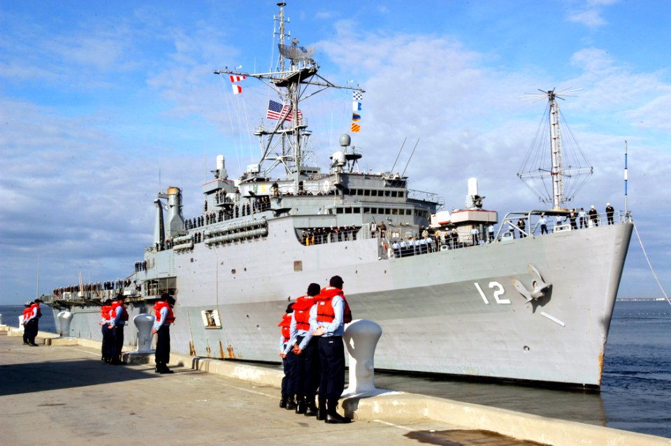 US Navy 070104-N-1713L-032 Line handlers stand at parade rest as the amphibious transport dock ship USS Shreveport (LPD 12) departs Naval Station Norfolk
