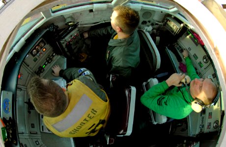 US Navy 070113-N-5345W-002 For the first time in more than a year, Sailors man the controls for steam-powered bow catapult number two from inside the Integrated Catapult Control Station (ICCS), or the bubble, during preparation