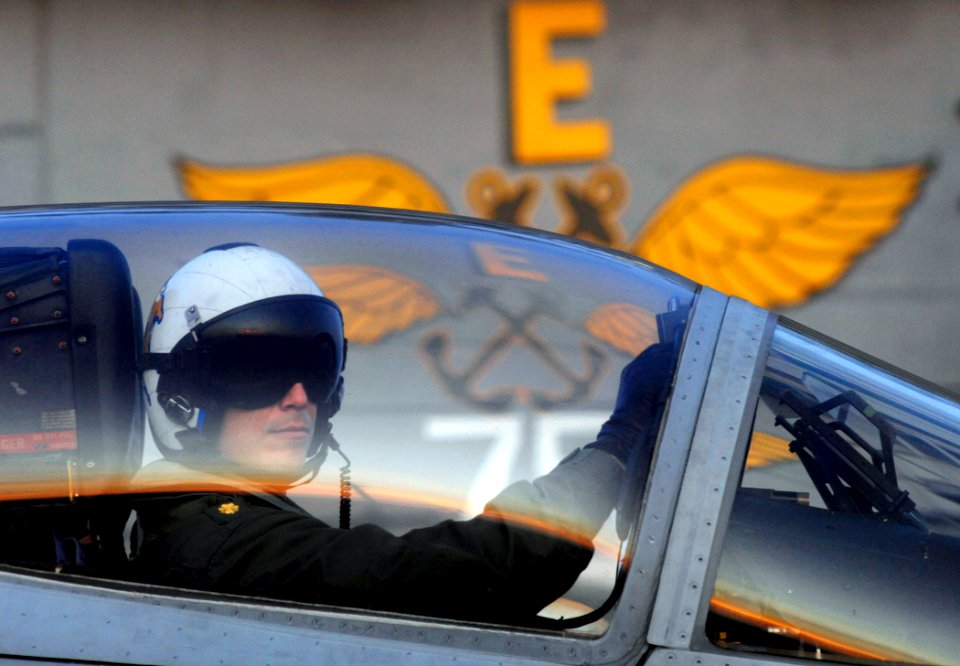 US Navy 070113-N-5345W-084 A naval aviator assigned to Strike Fighter Test Squadron Two Three (VXA-23) looks out from the cockpit of his F-A-18C Hornet after completing a test flight during flight operations