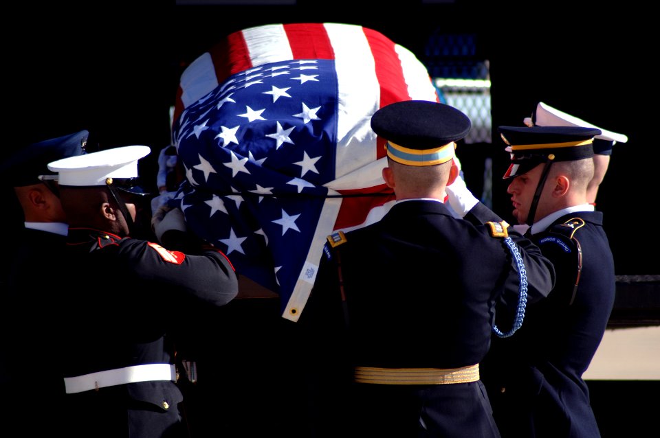 US Navy 070102-F-8968M-263 The Ceremonial Honor Guard places the casket of Gerald R. Ford, 38th President of the United States, into the VC-25 aircraft during a military departure ceremony held in his honor