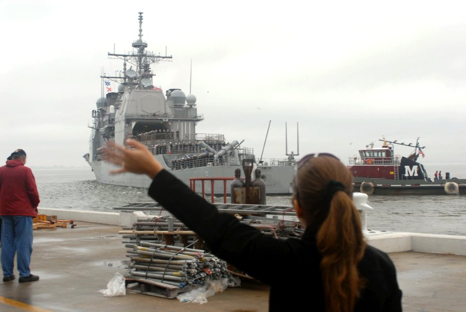 US Navy 070105-N-4238B-042 Family and friends say good-bye to their loved ones aboard the guided missile cruiser USS Vella Gulf (CG 72) as the ship prepares to deploy from Naval Station Norfolk