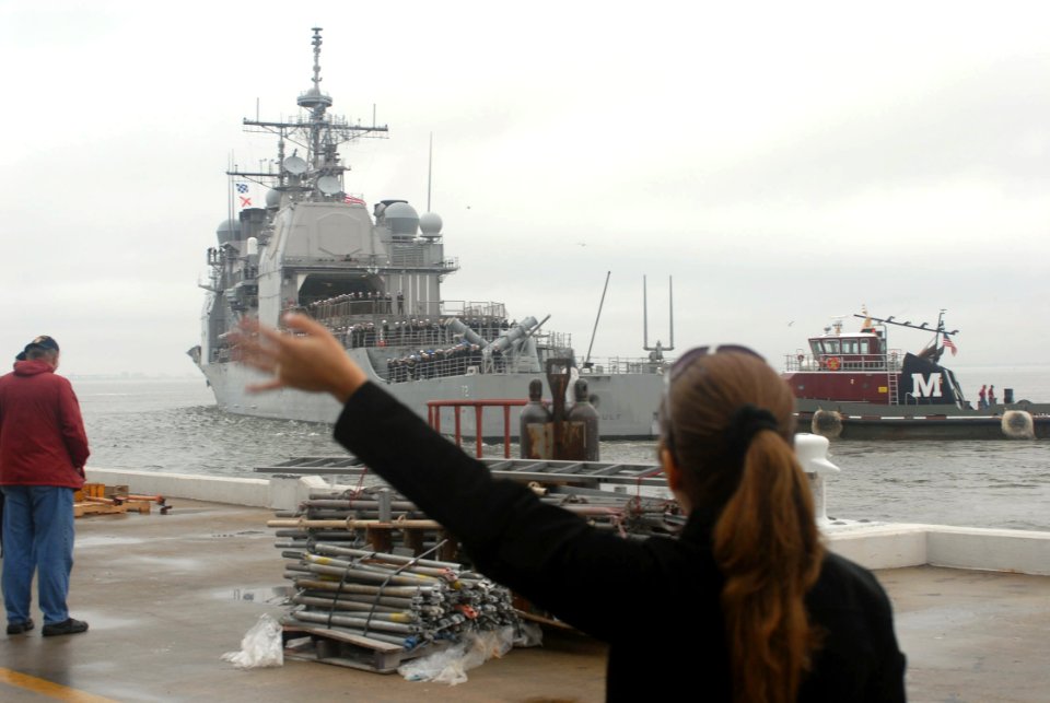 US Navy 070105-N-4238B-042 Family and friends say good-bye to their loved ones aboard the guided missile cruiser USS Vella Gulf (CG 72) as the ship prepares to deploy from Naval Station Norfolk photo