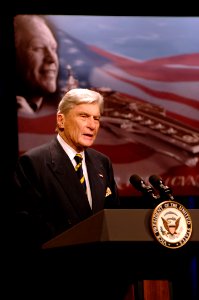 US Navy 070116-N-3642E-110 Sen. John Warner speaks to an audience of 300 during the official naming ceremony of the USS Gerald R. Ford (CVN 78), the first aircraft carrier in the Ford class of carriers