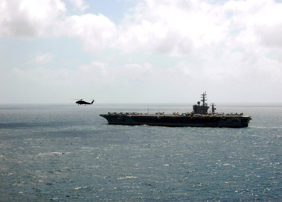 US Navy 070110-N-0490C-004 An SH-60F Seahawk helicopter assigned to the Nightdippers of Helicopter Anti-submarine Squadron Five (HS-5) flies near the Nimitz-class aircraft carrier USS Dwight D. Eisenhower (CVN 69)