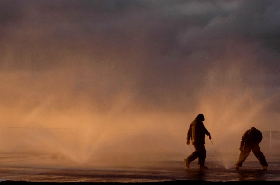 US Navy 070117-N-2659P-063 Sailors from air department aboard Nimitz-class carrier USS John C. Stennis (CVN 74) participate in a salt-water flight deck wash down