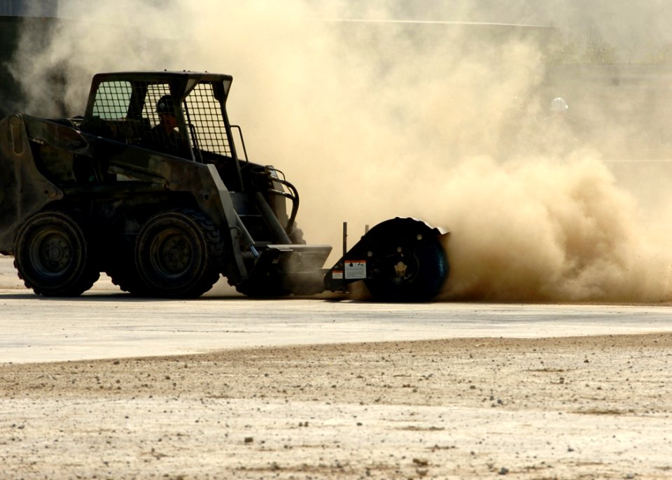 US Navy 070125-N-0775Y-051 Equipment Operator Constructionman Albert Amozarrutia, a Seabee assigned to Naval Mobile Construction Battalion Three (NMCB-3) operates a rotary brush during a runway repair exercise at Kadena Air Bas