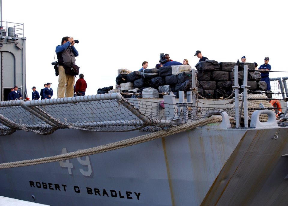 US Navy 070112-N-8544C-003 Sailors aboard the guided missile frigate USS Robert G. Bradley (FFG 49) prepare to offload 23 tons of illegal drugs seized in a multi-national and interagency effort to interdict the flow of narcotic