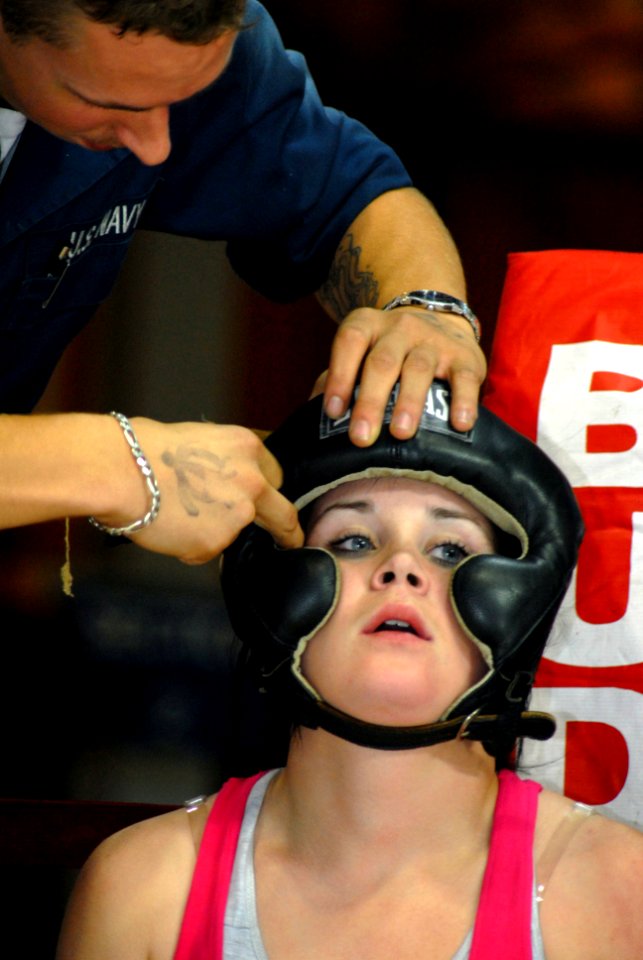 US Navy 070119-N-4965F-014 Fire Controlman 3rd Class Kris Merritt, assigned to Arleigh Burke-class guided-missile destroyer USS Chafee (DDG 90), has her hair put underneath her headgear