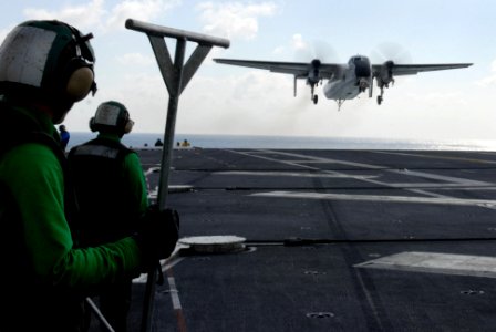 US Navy 070121-N-0684R-025 Sailors from air departments prepare to reset the flight deck after a C-2A Greyhound attached to the Providers of Fleet Logistics Support Squadron Three Zero (VRC-30) lands