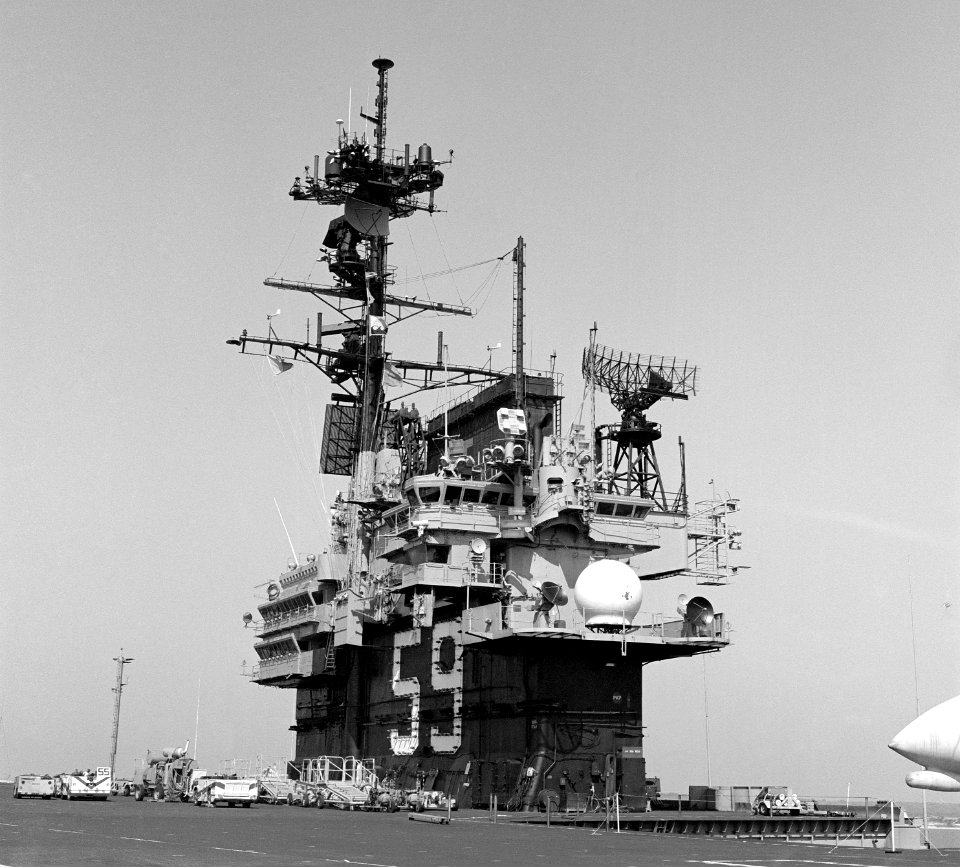 USS Forrestal (CV-59) port quarter view of island and masts