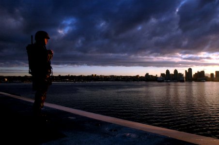 US Navy 070120-N-2659P-064 Aviation Boatswain's Mate Handling Airman Joseph Jackson stands force protection watch on the flight deck of the Nimitz-Class aircraft carrier USS John C. Stennis (CVN 74) as it pulls out of San Diego
