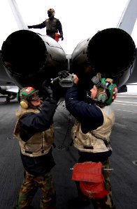US Navy 070121-N-5345W-043 Aviation Structural Mechanic 3rd Class Matt Williams and Aviation Structural Mechanic 2nd Class Piotr Glod, both assigned to the Golden Warriors of Strike Fighter Squadron Eight Seven (VFA-87), work o