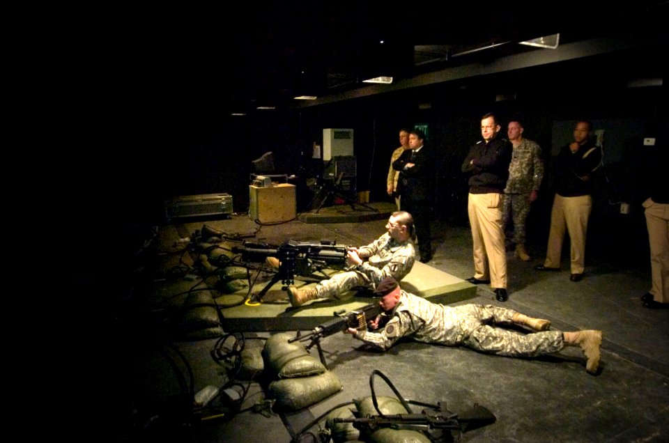US Navy 070119-N-0696M-429 Chief of Naval Operations (CNO) Adm. Mike Mullen watches as Army drill sergeants fire weapons at the Battle Simulation Center at Ft. Jackson