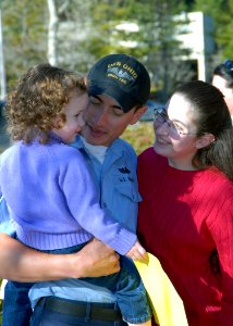 US Navy 070128-N-7656R-002 Sonar Technician (Submarine) 3rd Class Brandon L. Boutin, assigned to USS Ohio (SSGN 726), is the first to receive a hug from his daughter upon returning from Pearl Harbor, Hawaii, following a two-and