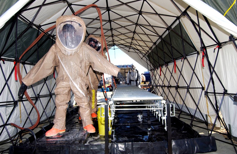 US Navy 070125-N-7518E-064 Members of the 6th Civil Support Team go through the decontamination clean-up station after inspecting a vessel for hazardous materials during an exercise