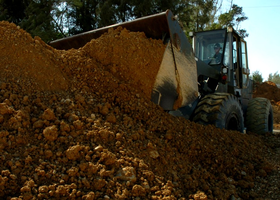 US Navy 070125-N-0775Y-015 Construction Electrician 2nd Class T.J. Crawford, a Seabee assigned to Naval Mobile Construction Battalion Three (NMCB-3), operates a front end loader during a runway repair exercise at Kadena Air Bas