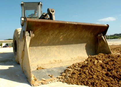 US Navy 070125-N-0775Y-006 Construction Electrician 2nd Class T.J. Crawford, a Seabee assigned to Naval Mobile Construction Battalion Three (NMCB-3) operates a front end loader during a runway repair exercise at Kadena Air Base
