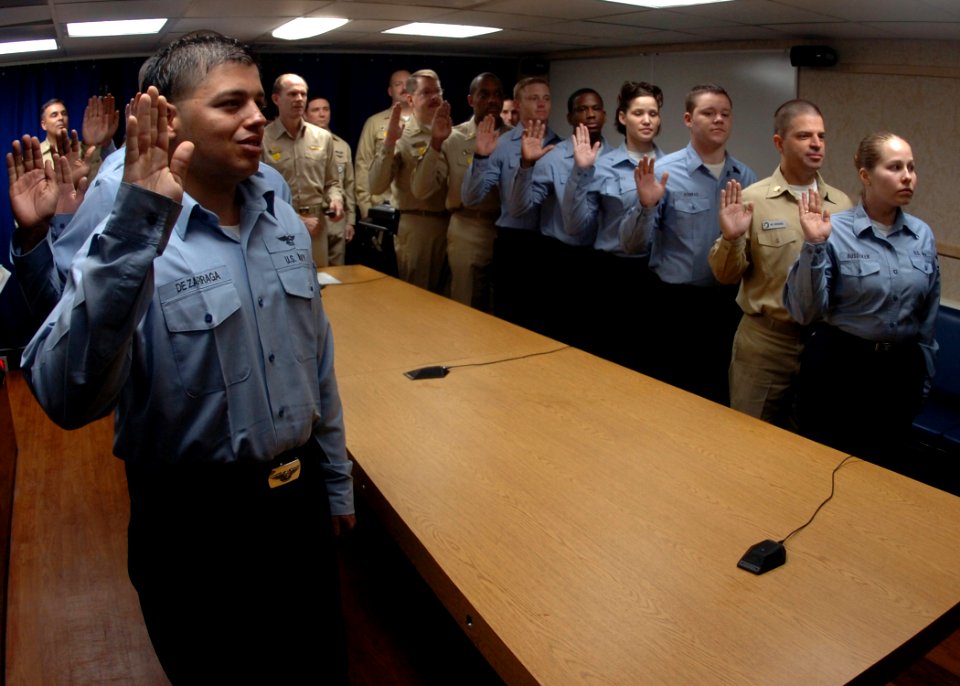 US Navy 070129-N-8907D-001 Sixteen Sailors aboard Nimitz-class aircraft carrier USS Dwight D. Eisenhower (CVN 69) repeat the Oath of Enlistment presided over by astronauts U.S. Navy Capt. Michael Lopez-Alegria and U.S. Navy Cmd