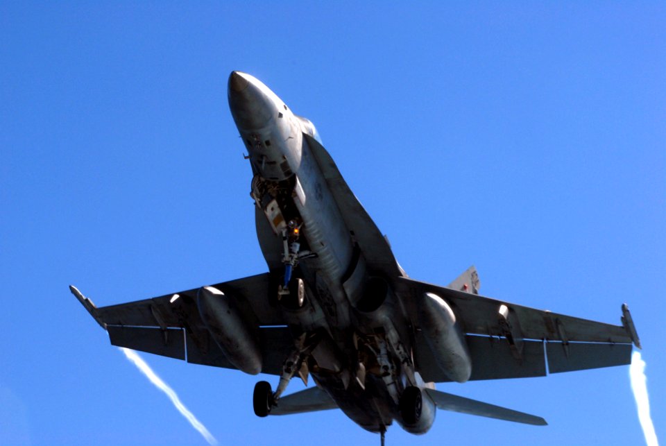 US Navy 070123-N-2659P-148 An incoming F-A-18C descends onto the flight deck of the Nimitz-class aircraft carrier USS John C. Stennis (CVN 74)