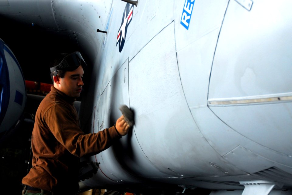 US Navy 070128-N-9928E-003 Airman Jason Cotenese cleans an S-3B Viking assigned to the