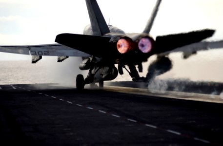 US Navy 070128-N-7130B-169 In a flash of steam and fire, an F-A-18C Hornet assigned to the Stingers of Strike Fighter Squadron One One Three (VFA-113) rockets down the flight deck of USS Ronald Reagan (CVN 76) aft