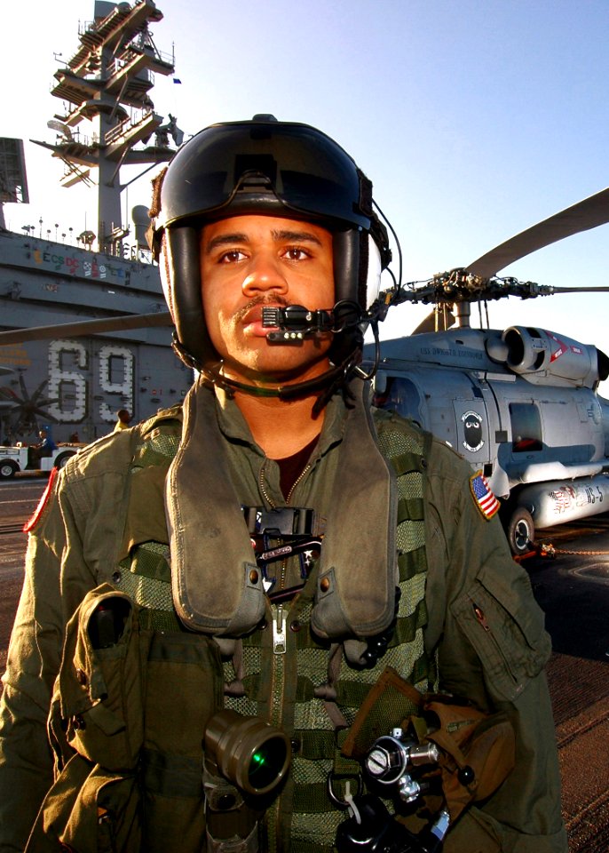 US Navy 070124-N-0490C-001 Lt. j.g. Michael Frisby, a pilot attached to the Nightdippers of Helicopter Anti-submarine Squadron Five (HS-5) prepares for flight operations aboard the Nimitz-class aircraft carrier USS Dwight D. Ei