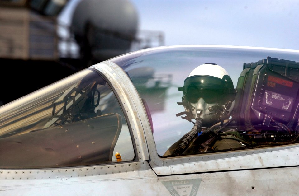 US Navy 070128-N-7130B-050 Watching the hand signals of an aircraft handler on the flight deck of USS Ronald Reagan (CVN 76), a pilot assigned to the Stingers of Strike Fighter Squadron One One Three (VFA-113) is directed into