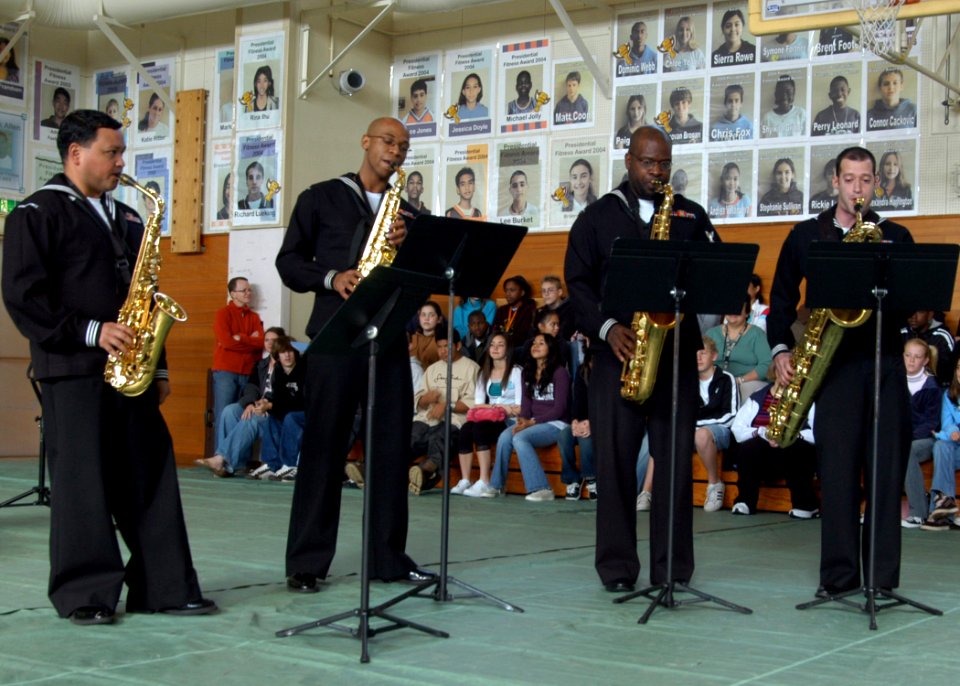 US Navy 070129-N-9604C-101 From left, Musician 2nd Class Jose Acosta, Musician 3rd Class Phil Martin, Musician 2nd Class Lloyd Whitty and Musician 2nd Class Richard Devoe perform The Entertainer to students at Lester Middle Sch