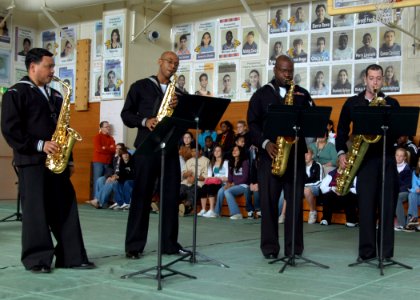 US Navy 070129-N-9604C-101 From left, Musician 2nd Class Jose Acosta, Musician 3rd Class Phil Martin, Musician 2nd Class Lloyd Whitty and Musician 2nd Class Richard Devoe perform The Entertainer to students at Lester Middle Sch