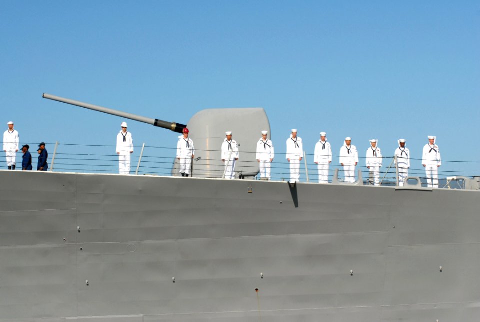US Navy 070203-N-4965F-020 Sailors aboard guided missile destroyer USS Russell (DDG 59) man the rails as the ship gets underway from Naval Station Pearl Harbor