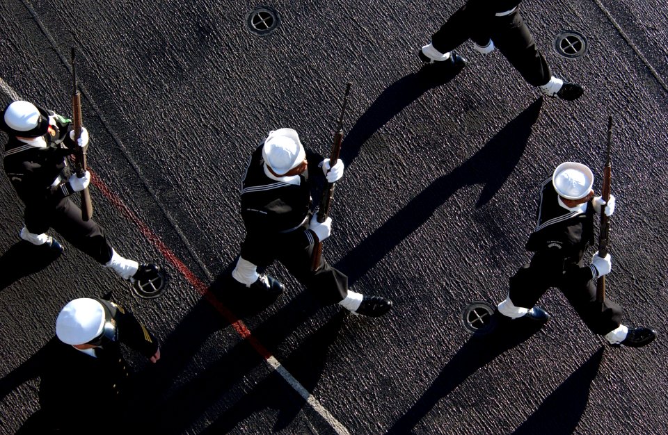 US Navy 070130-N-4776G-047 Following the eight o'clock bells ring signaling the start of the burial at sea ceremony on board USS Ronald Reagan (CVN 76)