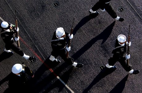 US Navy 070130-N-4776G-047 Following the eight o'clock bells ring signaling the start of the burial at sea ceremony on board USS Ronald Reagan (CVN 76)