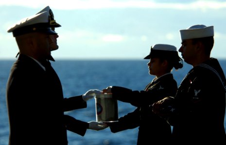 US Navy 070130-N-0555B-095 The remains of Senior Chief Aviation Machinist's Mate Gilberto Gordils Jr. pass from one Sailor to the next before they are committed to the ocean during a burial at sea ceremony held on board USS Ron