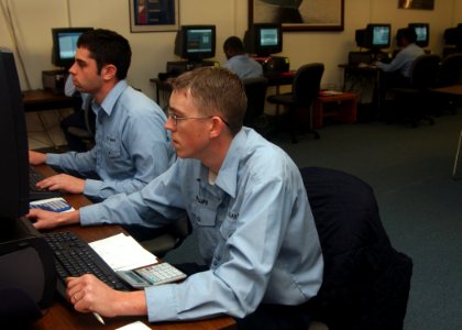 US Navy 070131-N-3285B-016 Sailors stationed aboard Naval Station Mayport study via computer to retake their ASVAB test during a two-week class at the Navy College Learning Center