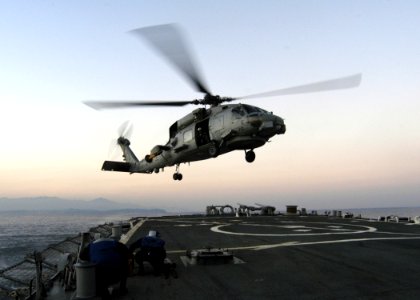 US Navy 070130-N-4649C-043 An SH-60 helicopter assigned to Helicopter Anti-Submarine Squadron Light Five One (HSL-51) prepares to land aboard Arleigh Burke-class guided missile destroyer USS Stethem (DDG 63)