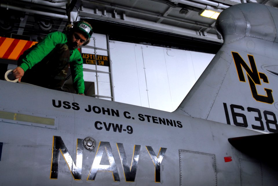US Navy 070126-N-9928E-077 Aviation Structural Mechanic 3rd Class Osvaldo Medrano prepares an EA-6B Prowler, assigned to Tactical Electronic Warfare Squadron One Three Eight (VAQ-138), for painting aboard Nimitz-class aircraft