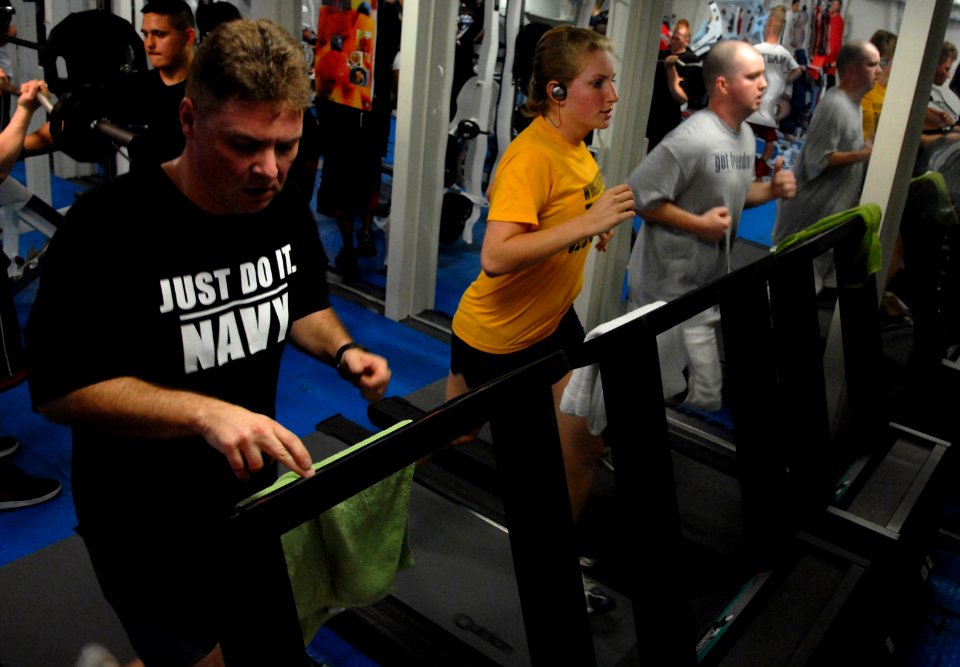 US Navy 070205-N-3659B-036 Sailors on board USS Ronald Reagan (CVN 76) run on newly installed treadmills in the mezzanine gym