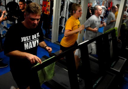 US Navy 070205-N-3659B-036 Sailors on board USS Ronald Reagan (CVN 76) run on newly installed treadmills in the mezzanine gym