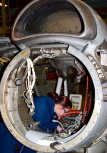 US Navy 070205-N-9150R-003 Aviation Structural Mechanic Airman Miranda Long makes repairs to a P-3C Orion engine housing at Fleet Readiness Center (FRC) Northwest aboard Naval Air Station Whidbey Island (NASWI)