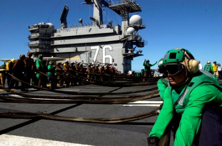 US Navy 070202-N-7130B-156 Rigging the training aircraft barricade, USS Ronald Reagan (CVN 76) flight deck personnel prepare to catch a simulated aircraft casualty