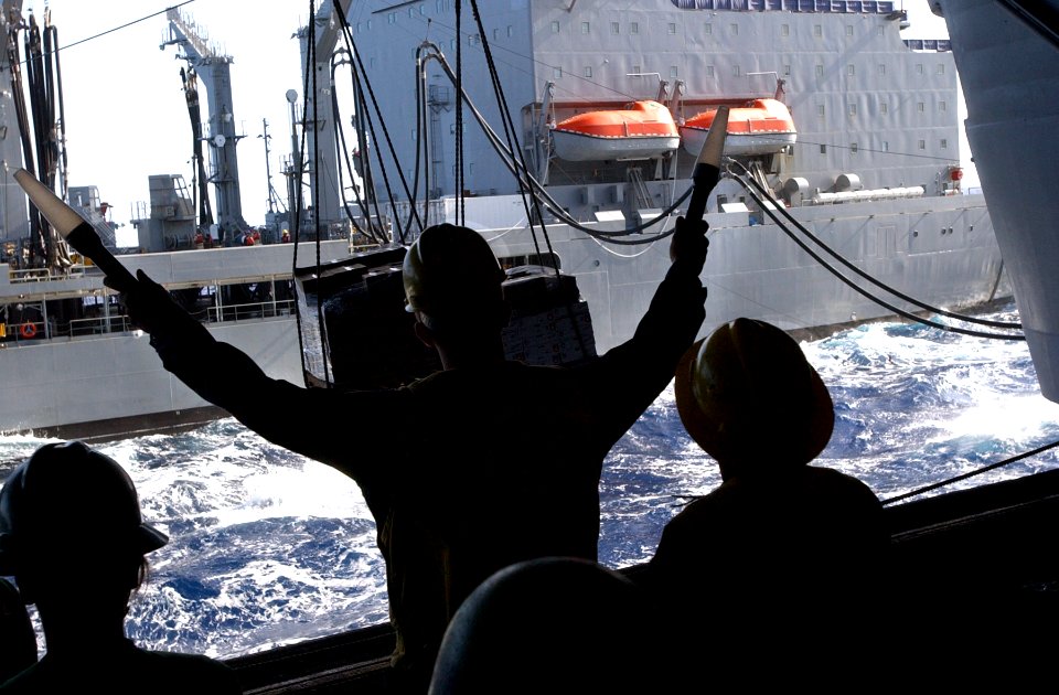 US Navy 070203-N-4009P-015 Sailors stand by ready to unload cargo from Military Sealift Command (MSC) underway replenishment ship USNS John Ericsson (TAO-194), to the hangar bay of the Nimitz-class aircraft carrier USS Ronald R