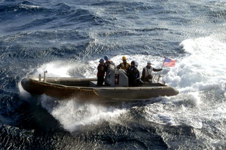 US Navy 070203-N-4649C-061 Sailors assigned to Arleigh Burke-class guided missile destroyer USS Stethem (DDG 63) receive training aboard a rigid hull inflatable boat (RHIB) photo