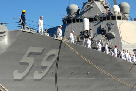 US Navy 070203-N-4965F-014 Sailors aboard guided missile destroyer USS Russell (DDG 59) man the rails prior to getting underway