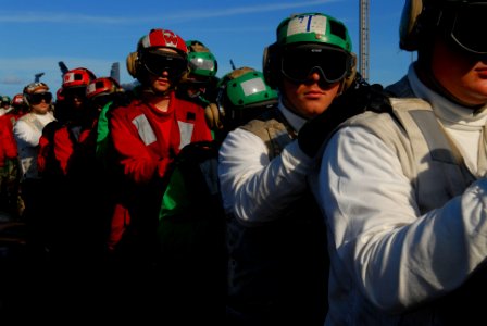 US Navy 070203-N-0684R-018 Sailors assigned to the air department line up in preparation to rig the barricade during flight deck drills