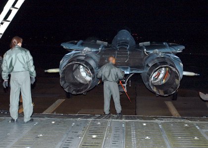 US Navy 070205-N-1082Z-045 Master Sgt. Brenda Kremer watches as Master Sgt. Bernard London performs a final inspection on the last F-14 Tomcat from Fighter Squadron Thirty One (VF-31) before it's loaded into a C-5 Galaxy photo
