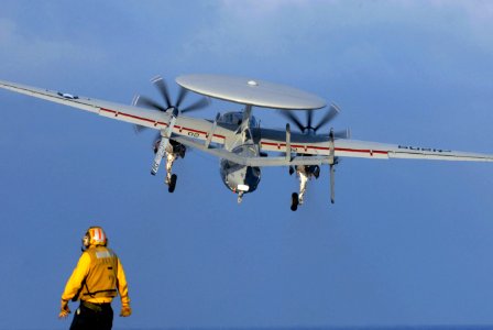 US Navy 070204-N-0684R-060 A flight deck director watches an E-2C Hawkeye assigned to the Golden Hawks of Carrier Airborne Early Warning Squadron One One Two (VAW-112)