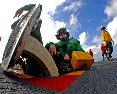US Navy 070201-N-8923M-020 Aviation Boatswain's Mate 3rd Class Amanda Trouscher mans her jet blast deflector (JBD) operator post during training flight operations aboard Nimitz-class aircraft carrier USS Harry S. Truman (CVN 75