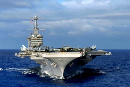 US Navy 070206-N-0684R-296 USS John C. Stennis (CVN 74) transits the Pacific Ocean prior to a photo exercise showcasing the entire John C. Stennis Carrier Strike Group (JCSSG) off the coast of Guam