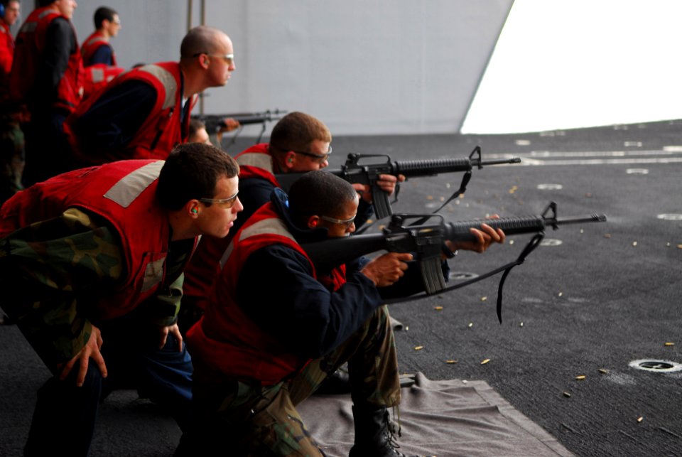 US Navy 070131-N-6326B-024 Gunners Mate 2nd Class Kyle Furlong ensures that proper safety procedures are enforced during an M-16 small arms qualifying shoot on an elevator aboard the nuclear-powered aircraft carrier USS Nimitz